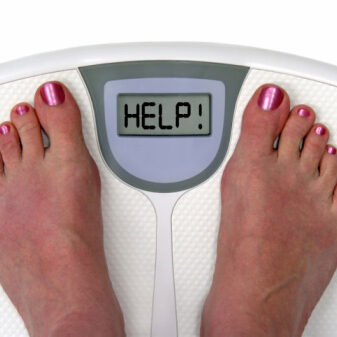 Woman on scales needs help with weight loss!